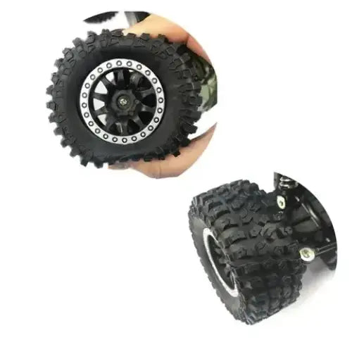 Black and silver rc truck wheel with deep-treaded rubber tire and a multi-spoke alloy rim.