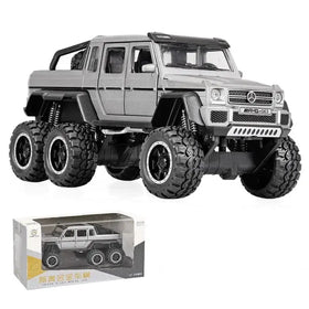 Silver metallic mercedes-benz amg g63 six-wheel drive toy truck with black tires and detailed suspension.