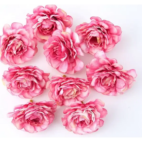 Pink artificial roses with layered petals and subtle white accents.