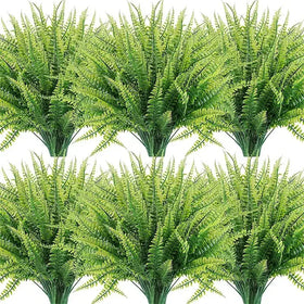 Green artificial fern bouquets with detailed, layered fronds and sturdy stems.