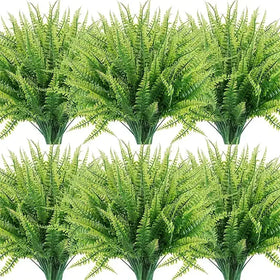 Green artificial fern bouquets with detailed, layered fronds and a realistic texture.