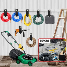 Green and black electric lawn mower with a yellow cord wrapped around its handle