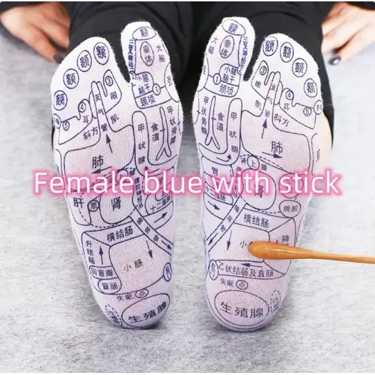 Blue foot socks with white chinese characters and diagrams printed on them, featuring a stick for acupressure points.