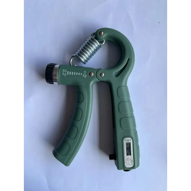 Green plastic grip strengthener with a metallic spring and digital display.
