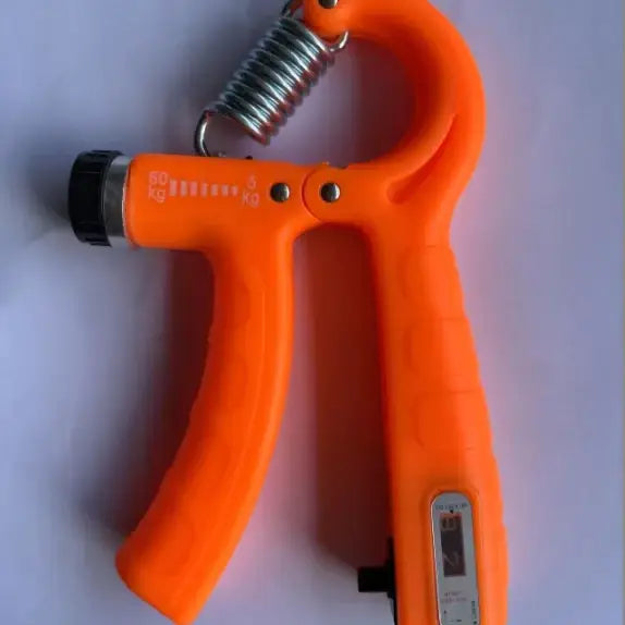 Bright orange plastic hand gripper with a metallic spring and digital display.