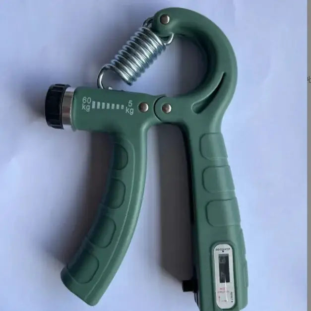 Green plastic hand gripper with a metal spring and adjustable resistance scale marked from 5 to 60 kg.