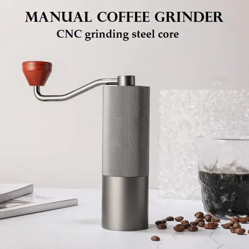 Silver manual coffee grinder with a cnc grinding steel core and a reddish-brown wooden handle.
