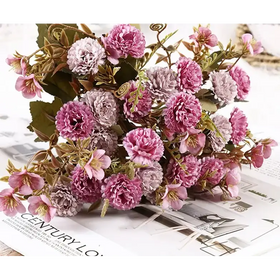 A bouquet of artificial flowers in shades of pink and lavender with detailed, layered petals and realistic green stems.