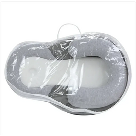 Gray and white memory foam baby sleep positioner wrapped in clear plastic.