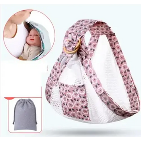 Pink floral-patterned baby carrier with mesh panels and a wooden ring buckle.