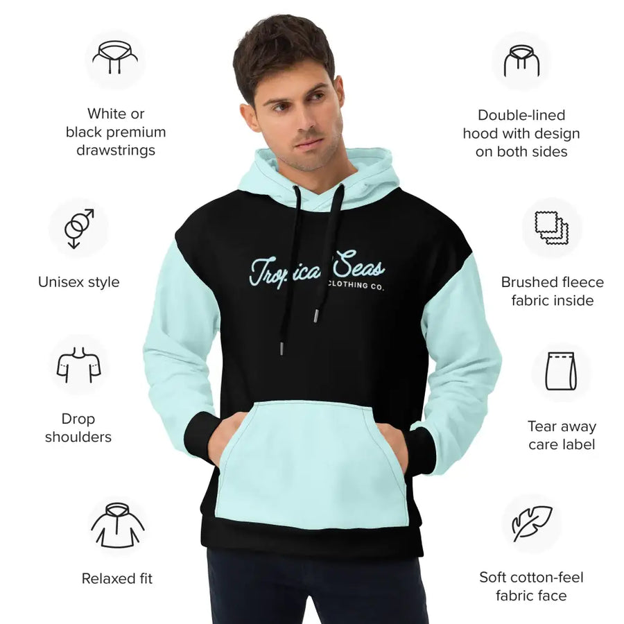 Black and light blue colorblock hoodie with ’tropical seas clothing co.’ logo in cursive script across the chest.