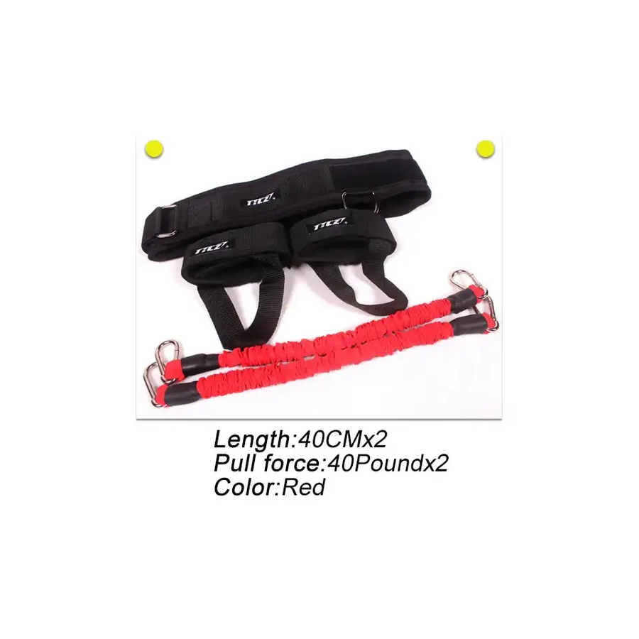 Red elastic resistance band with black reinforced ends and metal carabiners, paired with a black adjustable harness featuring ’ttec’ branding.