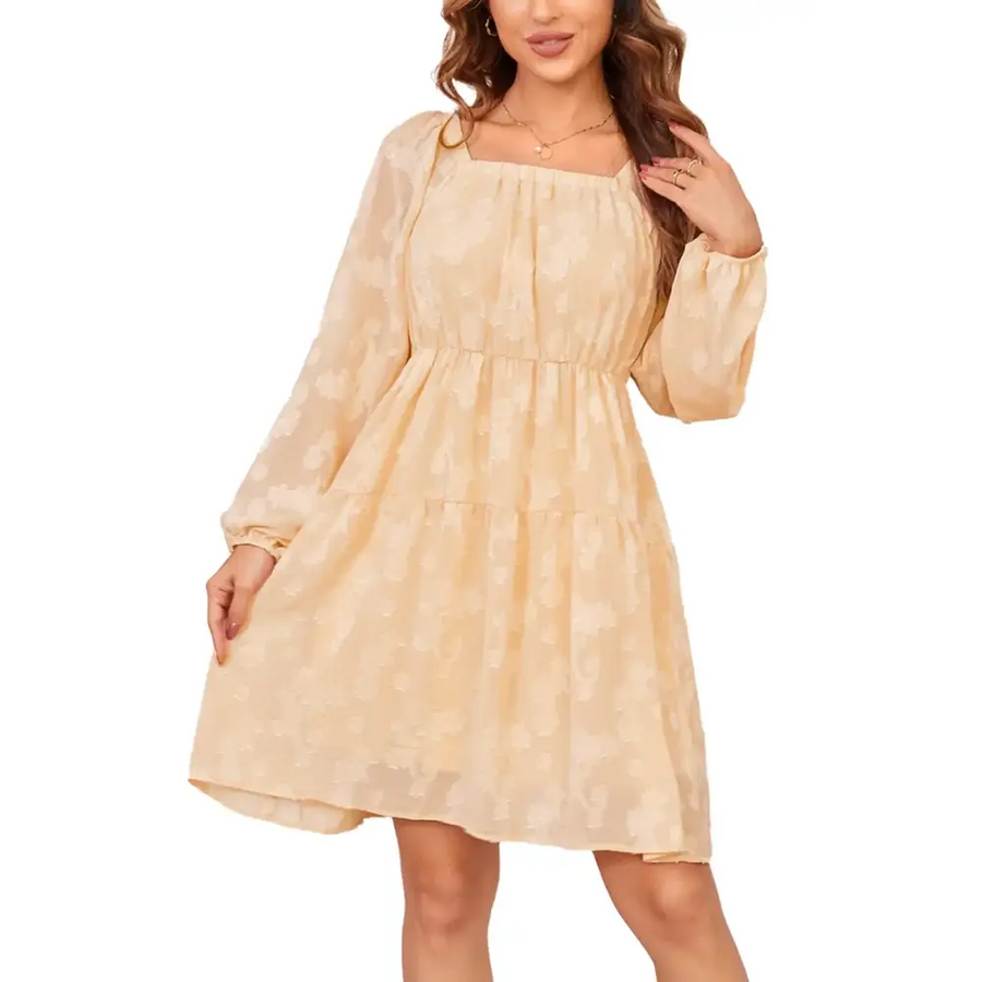 A soft beige, tiered dress with long sheer sleeves and a subtle pattern.