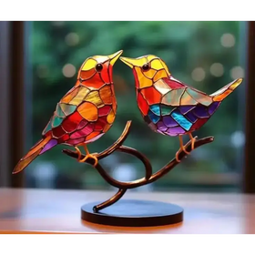 Vibrant stained glass birds perched on a curved branch, crafted with colorful mosaic panels and set upon a dark circular base.