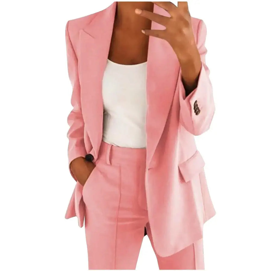 A soft pink blazer with a tailored fit and matching trousers, featuring subtle texture and elegant button details.
