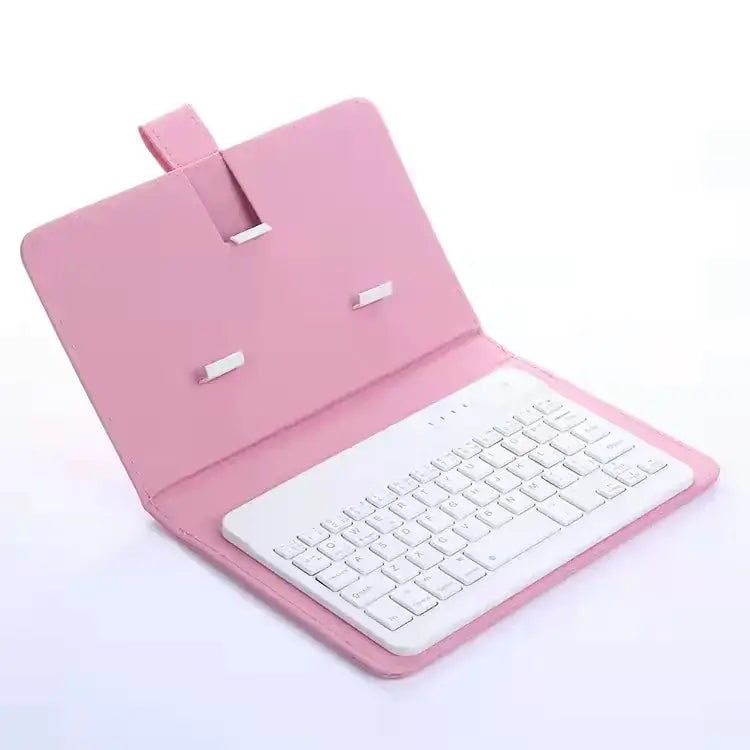 Pink leather-style tablet case with integrated white wireless keyboard.