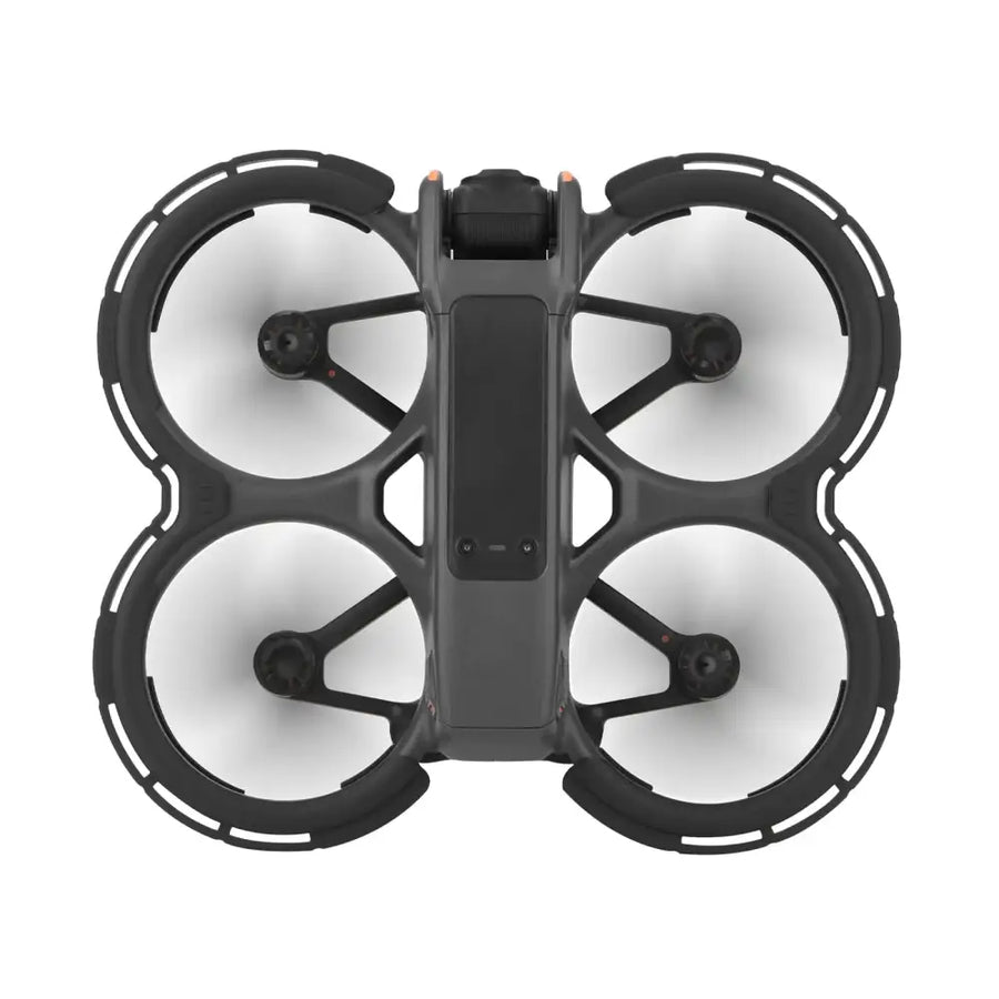 Black quadcopter drone with four circular propeller guards and a central camera housing.