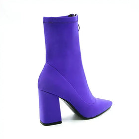 Vibrant purple ankle boot with a bold block heel and sleek, stretchy fabric upper.
