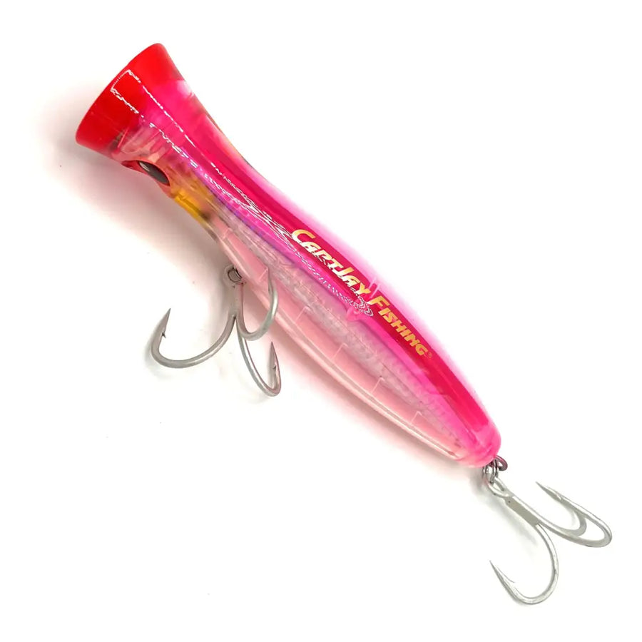 Vibrant pink and translucent plastic popper fishing lure with silver treble hooks, branded ’carpley fishing.’