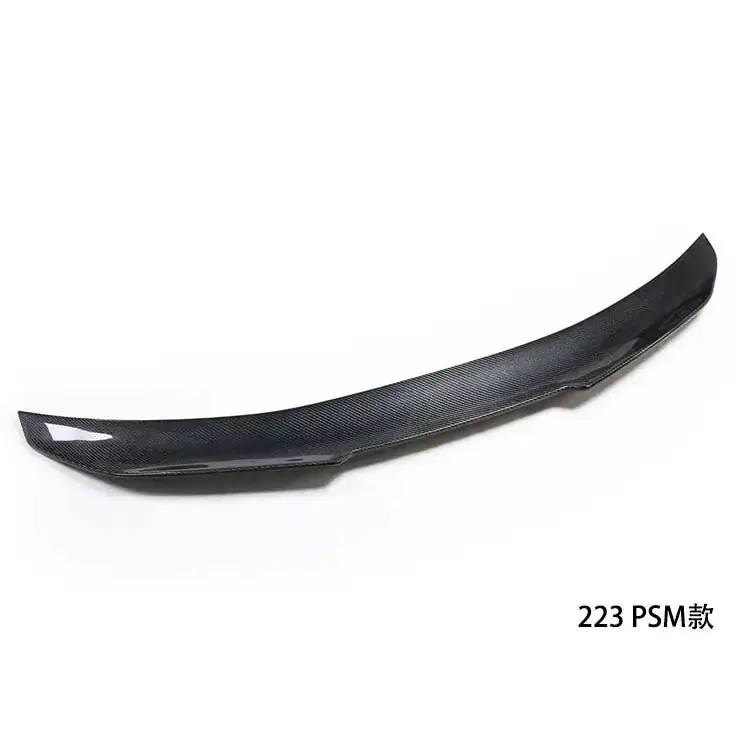 Black carbon fiber rear spoiler with a sleek, aerodynamic design and subtle white accent on the tip.