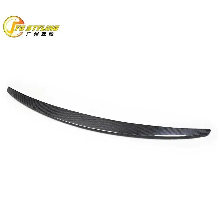 Black carbon fiber rear spoiler with a sleek, curved design.