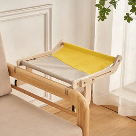 Light wood-framed cat bed with a gray and yellow fabric hammock insert