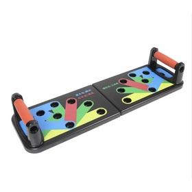 Black plastic push-up pad with colorful, segmented exercise zones and orange handles.