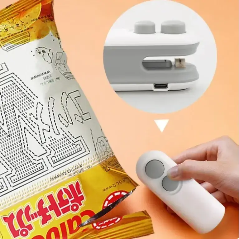 White handheld snack bag sealer with two gray circular buttons and a usb-c port on its underside.