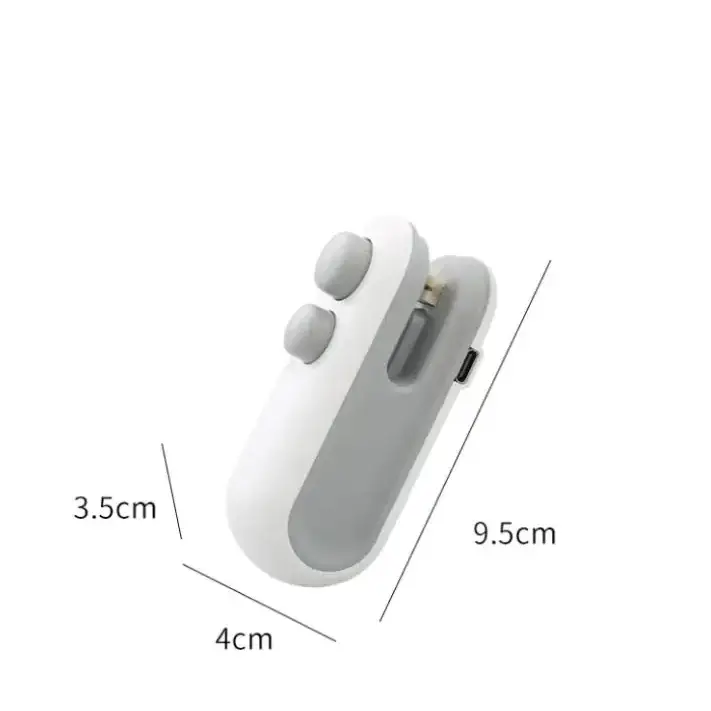 White and gray plastic usb charging clip with two circular buttons on top.