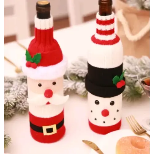 Red and white knitted santa and snowman wine bottle covers with festive holly details.