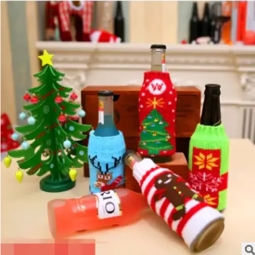 Christmas-themed bottle cozies in red, green, blue, and striped patterns adorn beer bottles on a table.