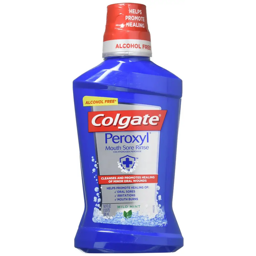 A blue colgate peroxy1 mouth sore rinse bottle with a red cap and white label detailing its alcohol-free, mild mint formula.