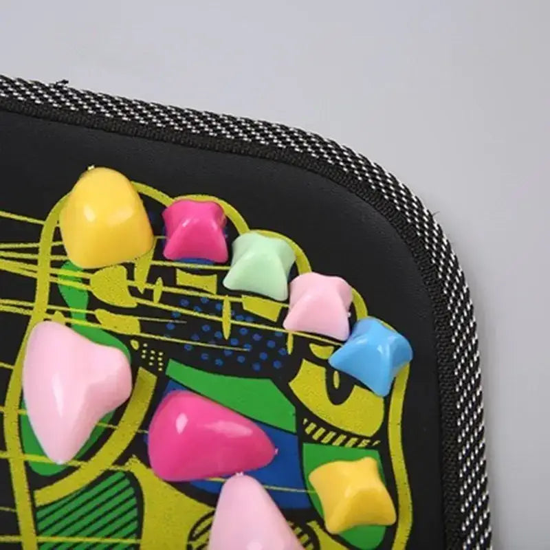 A black zipper pouch adorned with a vibrant, cartoonish design and decorated with colorful, glossy plastic spikes in pink, yellow, green, blue, and light pink.