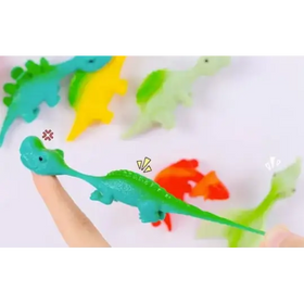 A teal-green, textured dinosaur stress ball with a long neck and small eyes.