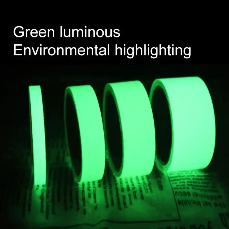 Green luminous adhesive tape rolls, glowing brightly in a dark setting.