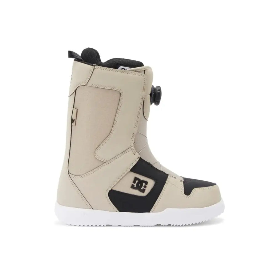 Beige and black dc snowboard boot with a white sole.