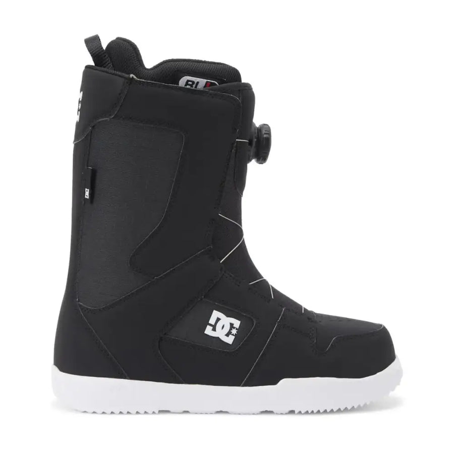 Black dc snowboard boot with white sole and logo branding.