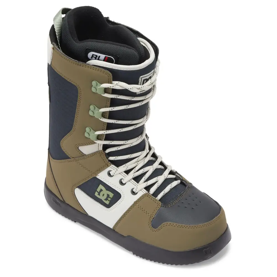 Olive and navy blue dc snowboard boot with white laces, green lace locks, and a black rubber sole.