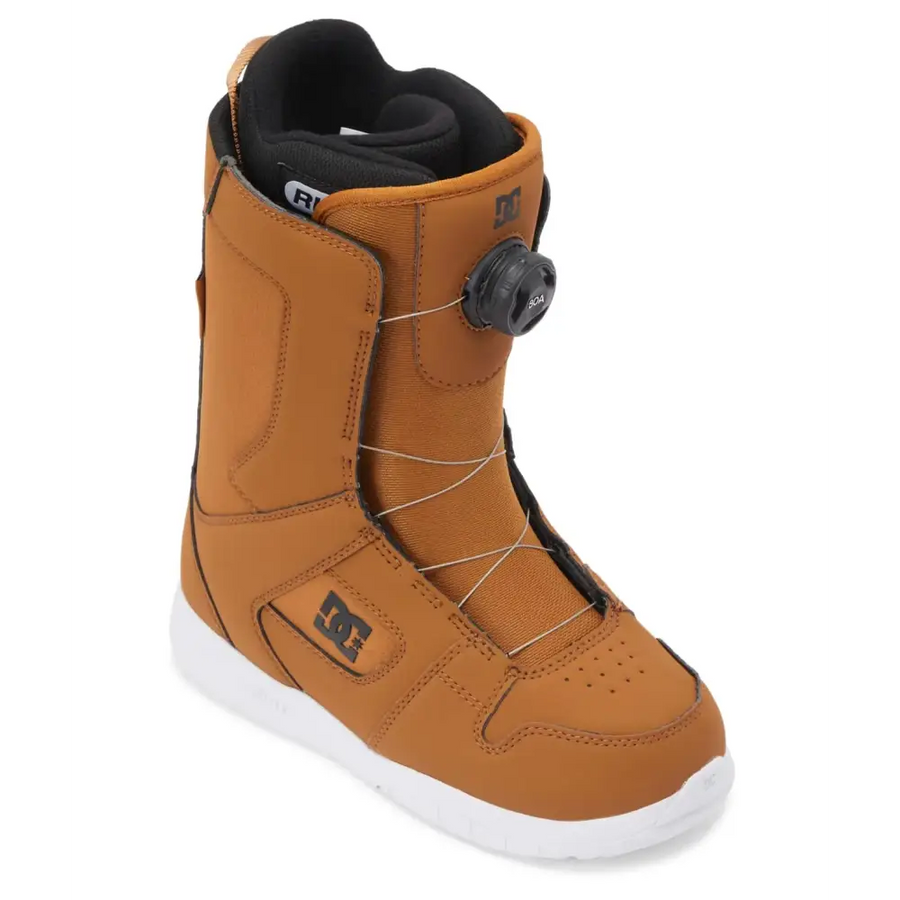 Tan dc snowboard boot with black accents and a white sole.