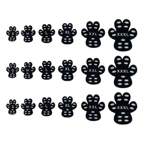 Black paw-shaped adhesive foot grips with white circular dots and size labels.