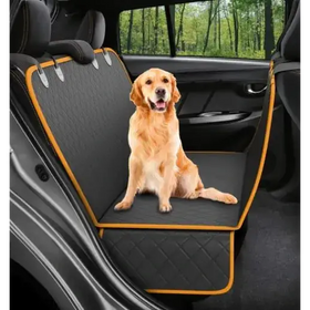 Black quilted car seat cover with orange trim, featuring a golden retriever sitting comfortably on it.