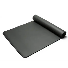 Black rubber yoga mat, partially rolled up with a textured surface.