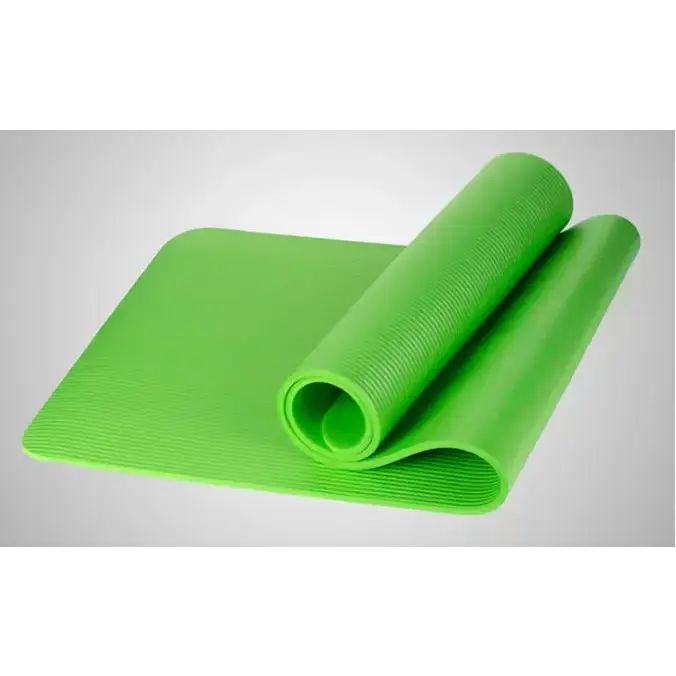 Bright green yoga mat with a textured, ribbed surface and rolled edge.