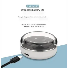 A sleek, silver and transparent circular wireless charger with a type-c port for fast charging.