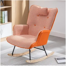 Orange and beige houndstooth patterned rocking chair with orange fabric accents and black metal legs