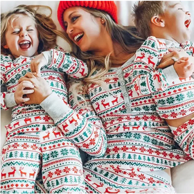 Red, green, and white christmas-themed pajama set with reindeer and snowflake patterns.