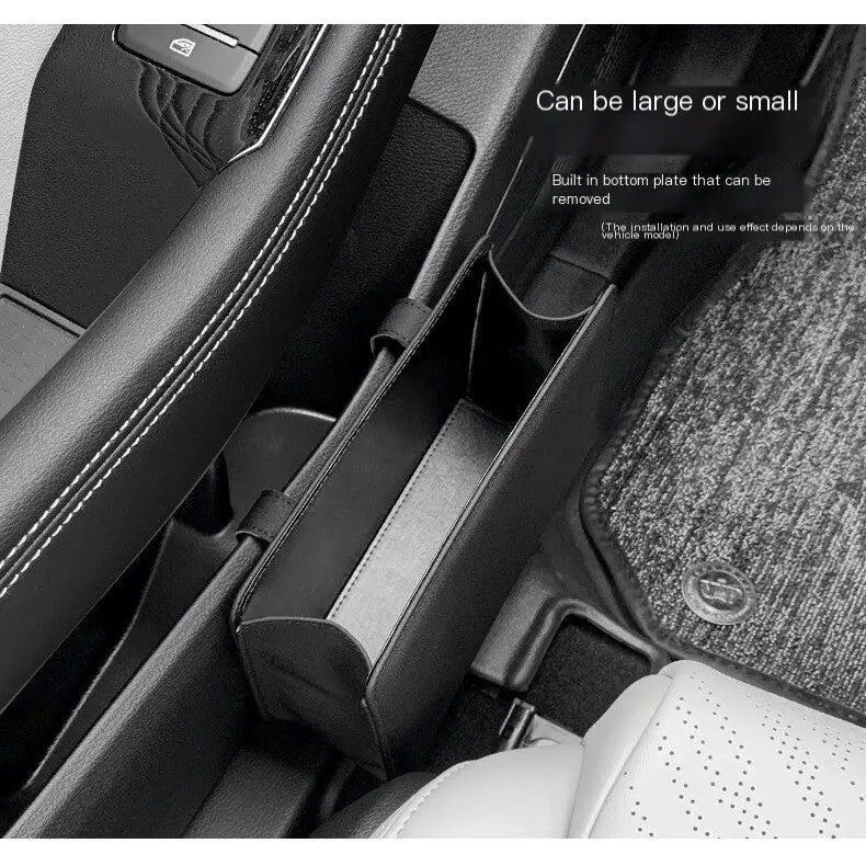 Black leather car center console organizer with a contrasting gray panel and stitched edges.