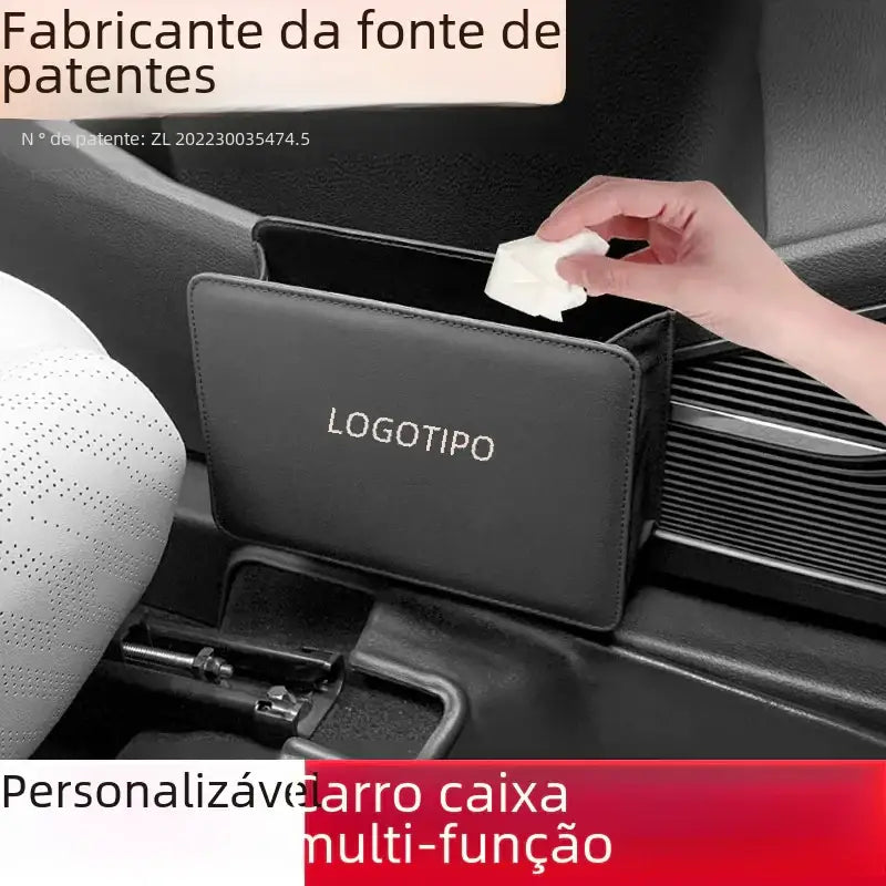 Black leather-like car tissue box holder with ’logotipo’ embossed in silver.