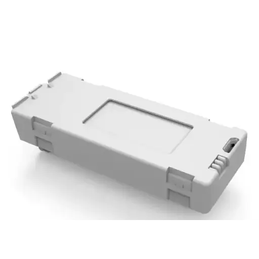 Gray plastic rectangular battery pack with a recessed slot and integrated charging port.