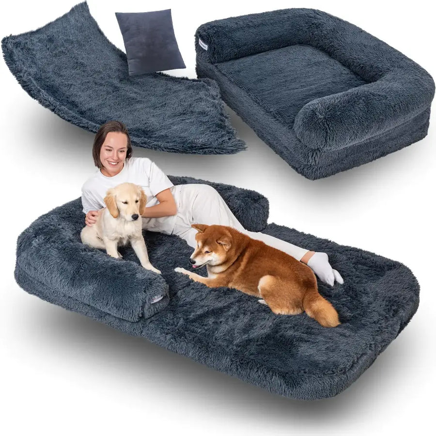 A plush, dark gray convertible pet bed with a soft, fluffy texture and built-in side cushions.